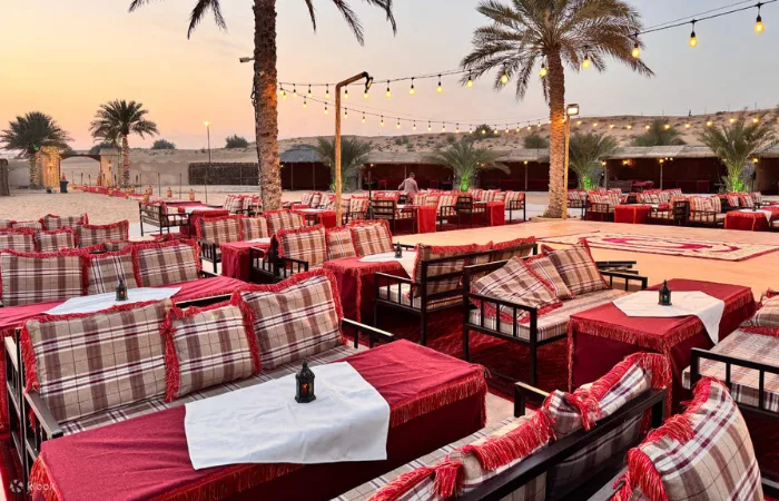 Camel ride and belly dance entertainment during desert safari BBQ dinner