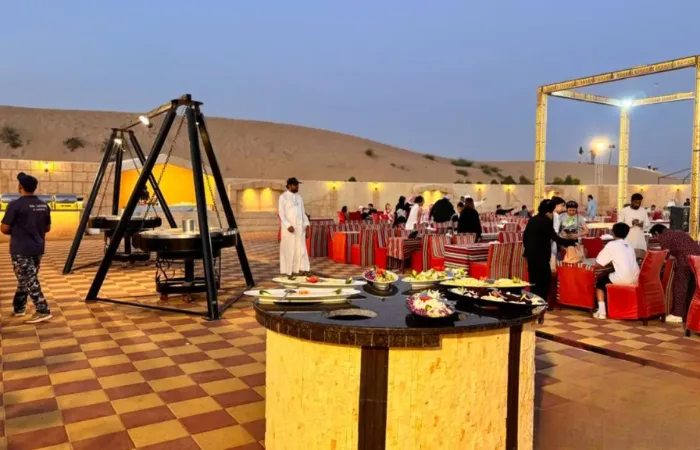Camel ride and belly dance entertainment during desert safari BBQ dinner