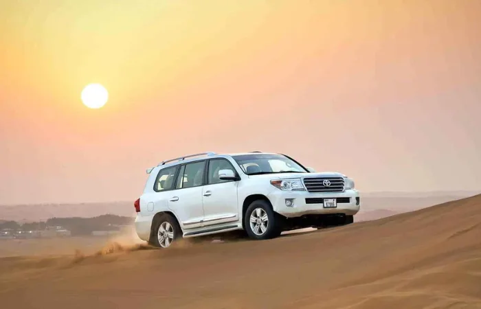 Morning Desert Safari Dubai – golden dunes at sunrise with 4x4 dune bashing