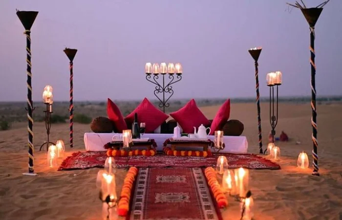 Private Desert Safari Dubai – romantic candlelight dinner setup under Arabian stars